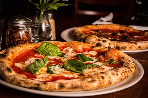 Cibo pizza - Specialties: Set in a restored 1913 bungalow, Cibo (pronounced "CHEE-boh") has hardwood floors, exposed brick, a stained-glass panel and a fireplace to set the mood while revitalizing the downtown Phoenix area with beautiful salads, …